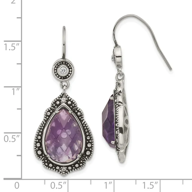Pair of silver teardrop dangle earrings with faceted amethyst stones surrounded by beaded bezels and round diamond accents on shepherd hook wires, shown against a measurement scale.