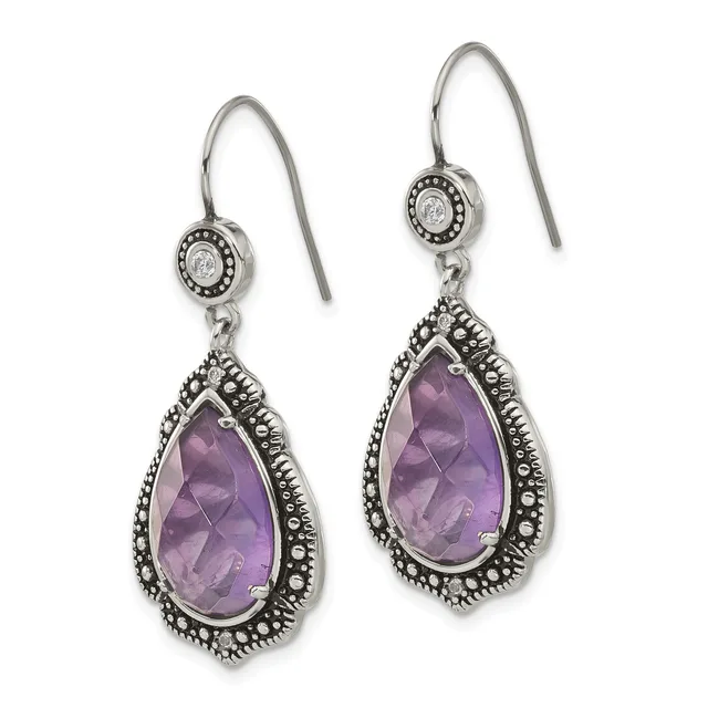 Pair of silver teardrop earrings with purple amethyst stones surrounded by ornate beaded borders, hanging from wire hooks with small circular diamond accents.