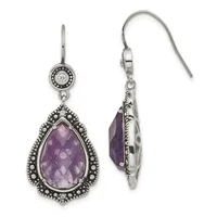 A pair of silver teardrop earrings with faceted purple amethyst stones surrounded by ornate beaded borders, shown from front and back views.