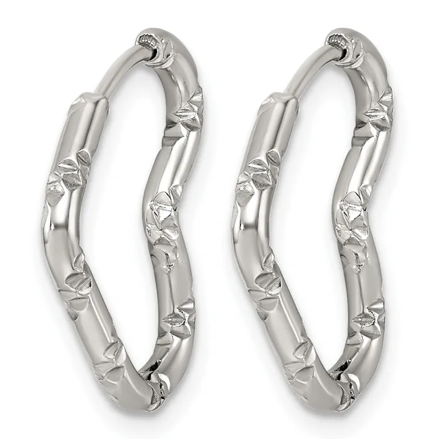 A pair of silver hoop earrings with textured leaf or floral detailing along the outer surfaces, displayed against a white background.
