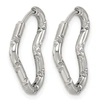 A pair of silver hoop earrings with textured leaf or floral detailing along the outer surfaces, displayed against a white background.