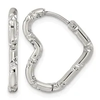 A pair of silver hoop earrings with a textured, hammered surface and hinged closures, displayed from front and side views.