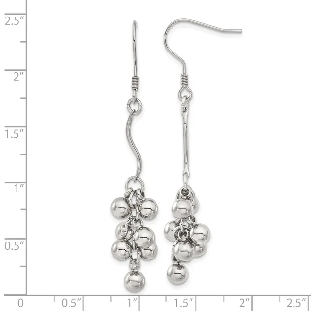 A pair of silver-toned dangle earrings with curved hooks, featuring clustered spherical beads suspended from chain links, displayed against a measurement ruler.