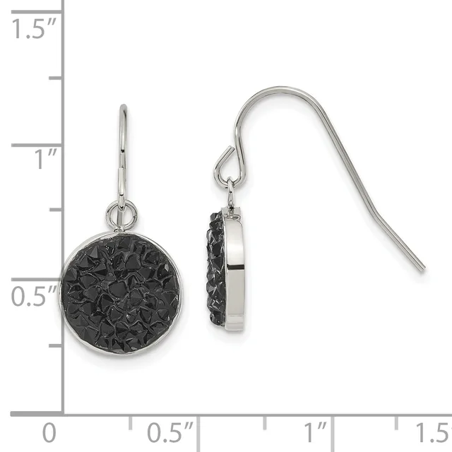 A pair of silver-tone dangle earrings with round black textured pendants, shown front and back view against a measurement ruler.