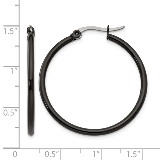 Black hoop earrings with hinged clasp backs shown next to a ruler measuring approximately 1.5 inches in diameter.