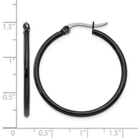 Black hoop earrings with hinged clasp backs shown next to a ruler measuring approximately 1.5 inches in diameter.