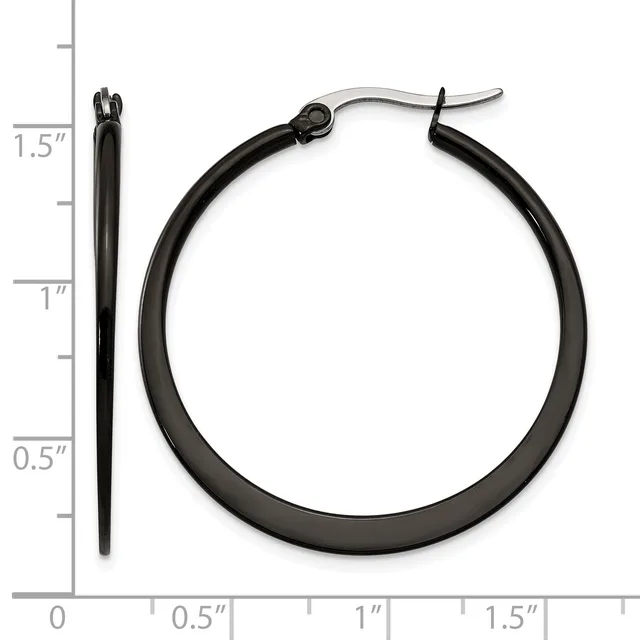 Black hoop earrings with stainless steel posts displayed next to a ruler showing the earrings measure approximately 1.5 inches in diameter.