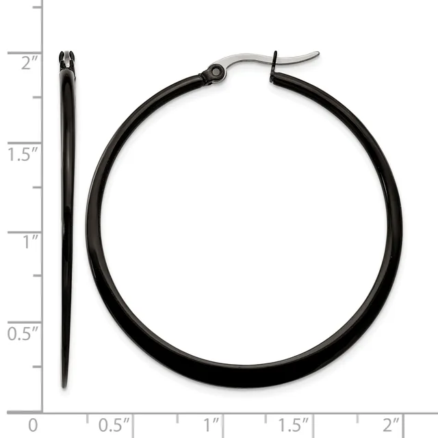 Black hoop earrings with curved posts, shown next to a ruler indicating they measure approximately two inches in length.