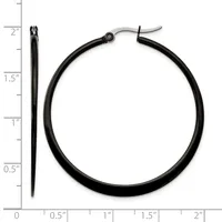 Black hoop earrings with curved posts, shown next to a ruler indicating they measure approximately two inches in length.