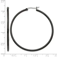 Two black metal hoop earrings displayed next to a ruler, showing the larger hoop measures approximately 2 inches in diameter and a smaller post earring measures about 2.25 inches in length.