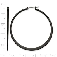 Black tubular hoop earrings displayed next to a ruler showing approximately 2.5 inches in diameter, with a hinged post closure visible at the top.