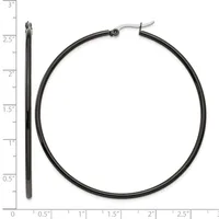 Black hoop earrings with a hinged closure, displayed next to a ruler showing one earring is approximately 2.5 inches long and the hoop diameter is about 2 inches.