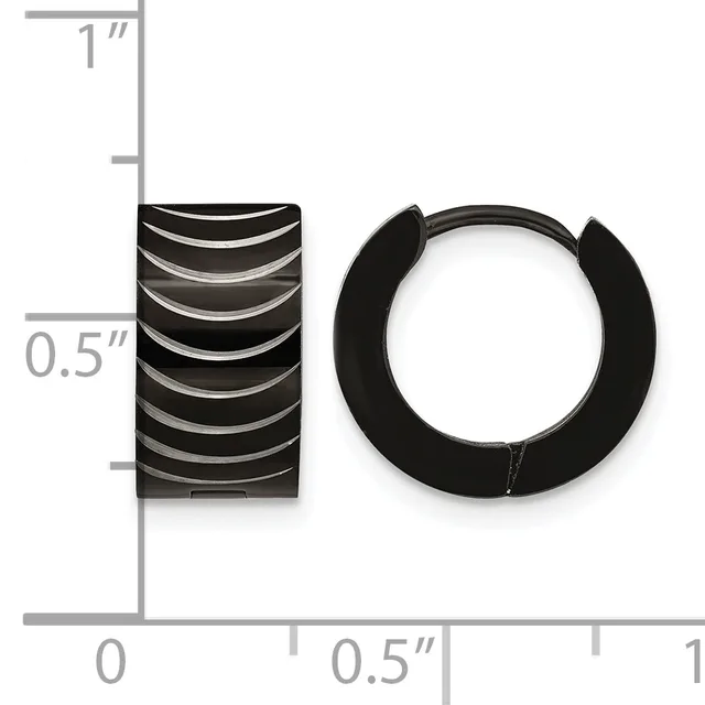 Black ridged barrel-shaped earring and black rubber huggie-style hoop earring displayed next to a ruler showing approximately 0.5 inch width and 1 inch height.
