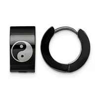 A pair of black and silver hoop earrings displayed next to a rectangular black pendant featuring a yin-yang symbol in silver and textured finish.