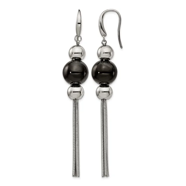 A pair of silver-tone dangle earrings with polished black and silver spheres stacked vertically, suspended from curved ear wires with long tassel chains.