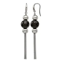A pair of silver-tone dangle earrings with polished black and silver spheres stacked vertically, suspended from curved ear wires with long tassel chains.