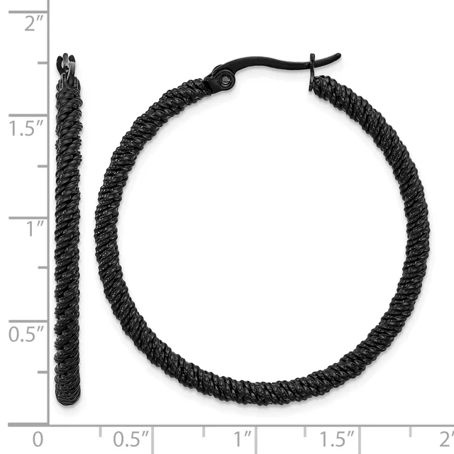 Black textured hoop earrings with a diameter of approximately one and one-half inches, shown with a measurement scale.