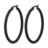 A pair of black textured hoop earrings with twisted rope detailing and hinged closures.