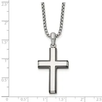 A stainless steel cross pendant with hollow rectangular arms hangs from a stainless steel chain, displayed against a measurement scale showing the pendant is approximately one inch wide and one and one-half inches tall.