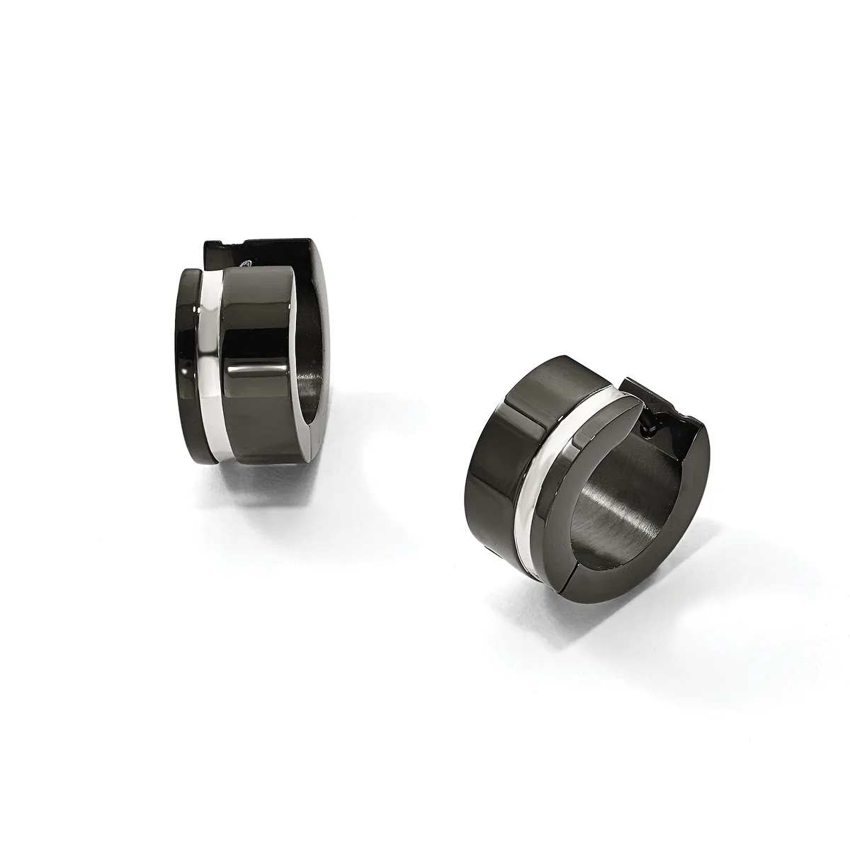 Two pairs of chunky stainless steel hoop earrings with polished and brushed finishes and small black hinged closures, shown from different angles.