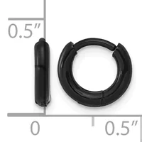 Black huggie hoop earrings with a half-inch diameter shown next to a measurement scale.
