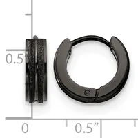 Two black textured huggie earrings shown front and side view against a measurement scale, approximately 0.5 inches in diameter.