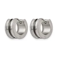A pair of silver-toned chunky hoop earrings with textured surfaces and a black stripe detail running through the center of each hoop.