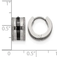 Two silver-tone metal huggie hoop earrings with textured glitter finish sides and a polished black center band, shown front and side view with a measurement scale indicating approximately 0.5 inches in diameter.