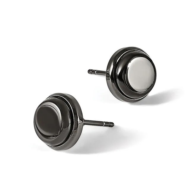 Two round stud earrings with polished gunmetal gray finish and white stone centers, displayed at angles on white background.