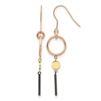 A pair of mixed-metal drop earrings with rose gold ear wires, circular rose gold rings, small gold disc charms, and black cylindrical tube pendants hanging at different lengths.
