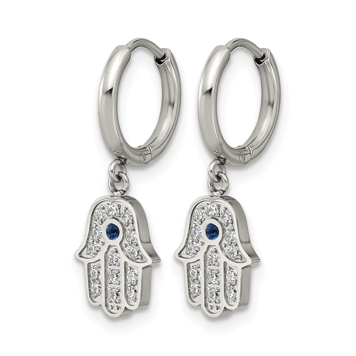 A pair of silver hoop earrings with dangling hamsa hand charms decorated with clear crystals and a blue sapphire stone in the center of each hand.