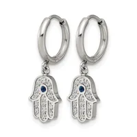 A pair of silver hoop earrings with dangling hamsa hand charms decorated with clear crystals and a blue sapphire stone in the center of each hand.