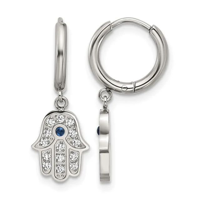 A pair of silver hoop earrings with hanging hamsa hand charms decorated with clear crystals and a small blue stone in the center.