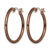 A pair of polished bronze-toned hoop earrings with hinged closures, displayed against a white background.