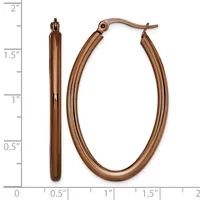 A pair of copper-colored oval hoop earrings with textured surfaces, shown next to a measurement scale indicating they are approximately two inches long.