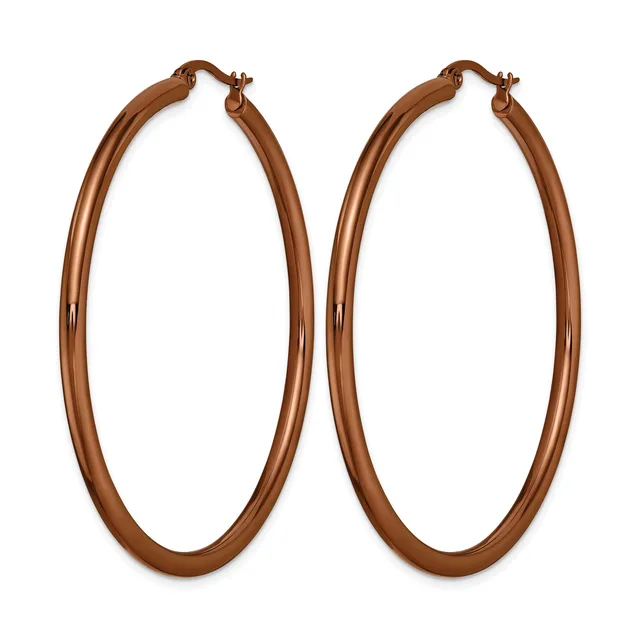 A pair of large copper-toned hoop earrings with a polished finish and hinged closures, displayed against a white background.