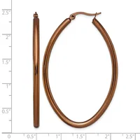 A pair of copper-colored oval hoop earrings displayed next to a ruler showing them to be approximately 2.5 inches long.