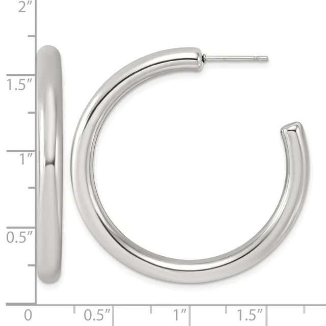 A pair of silver-toned hoop earrings with posts, shown front and side view against a measurement scale indicating approximately 1.5 inches in diameter.