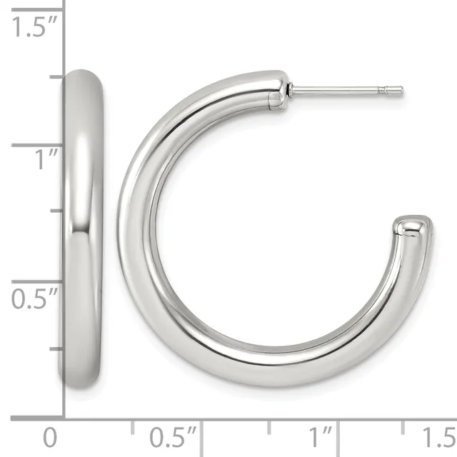 A pair of polished silver-toned chunky hoop earrings with a measurement scale showing dimensions up to 1.5 inches.