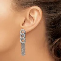 A woman wearing a long silver chain earring with interlocking oval links at the top and cascading strands hanging down, shown from the side view against her ear.