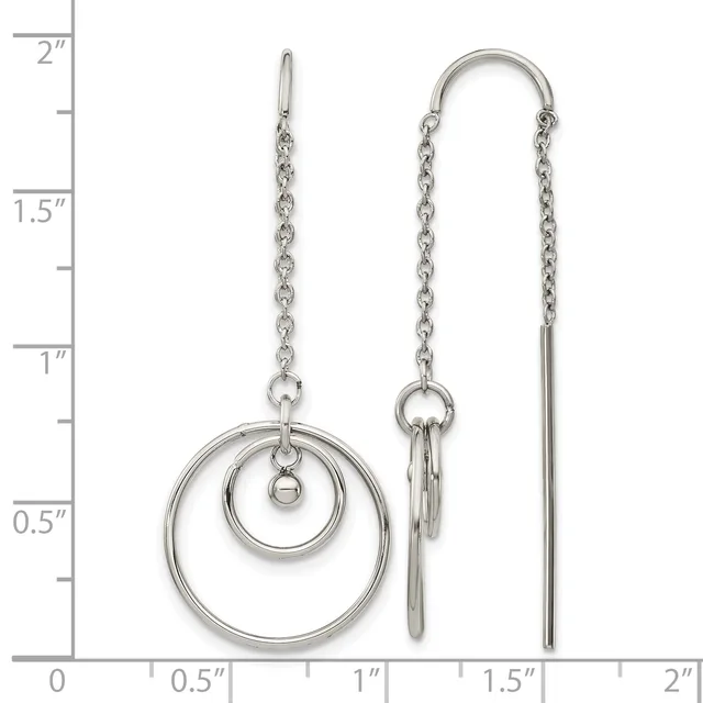 Pair of silver-toned chain earrings with concentric circle dangles on the left and threader style on the right, displayed against a ruler showing measurements up to two inches.