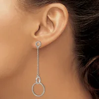 A silver chain drop earring with small oval loops at the top and bottom, worn on a model's earlobe.