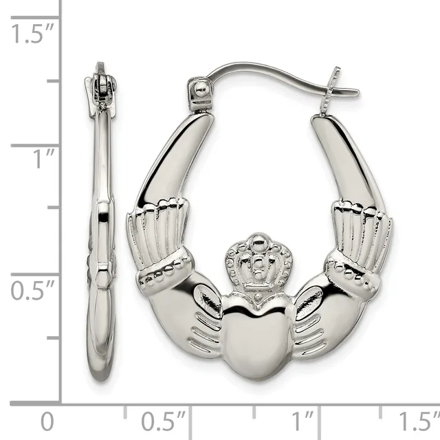 Silver-toned Claddagh hoop earrings with a heart center and hands, displayed next to a ruler showing approximately 1.5 inches in length.