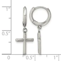 Pair of polished silver-tone huggie hoop earrings, one with a dangling cross charm, displayed against a ruler showing measurements up to one inch.