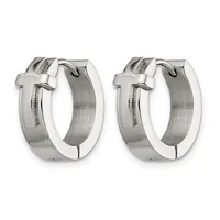 A pair of polished silver-tone hoop earrings with textured brushed centers and cross-shaped details on the front, shown from a front-facing angle.
