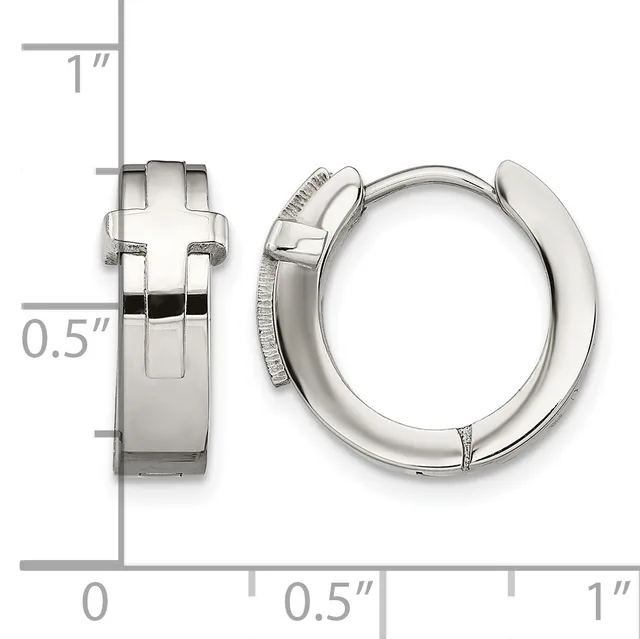 A pair of polished silver-toned hoop earrings with a cross motif on the front, shown from front and side views with a measurement scale indicating approximately one inch in diameter.