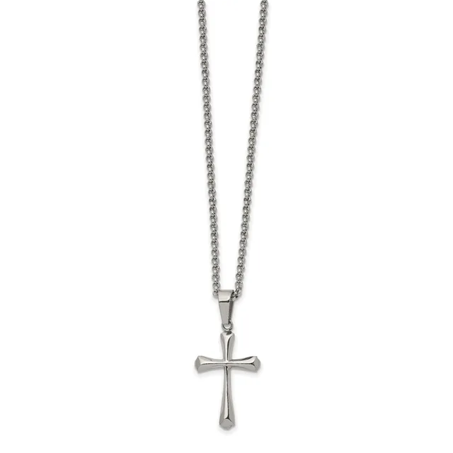 A silver-toned cross pendant hangs from a matching chain necklace against a white background.