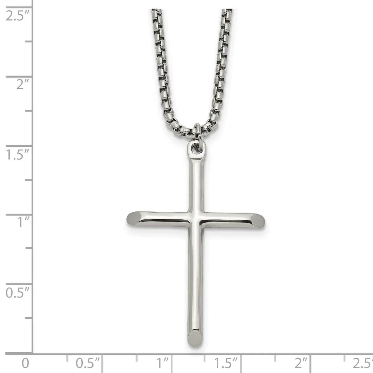 A polished silver cross pendant hanging from a box chain necklace, displayed against a ruler showing the cross is approximately one inch wide and two inches tall.