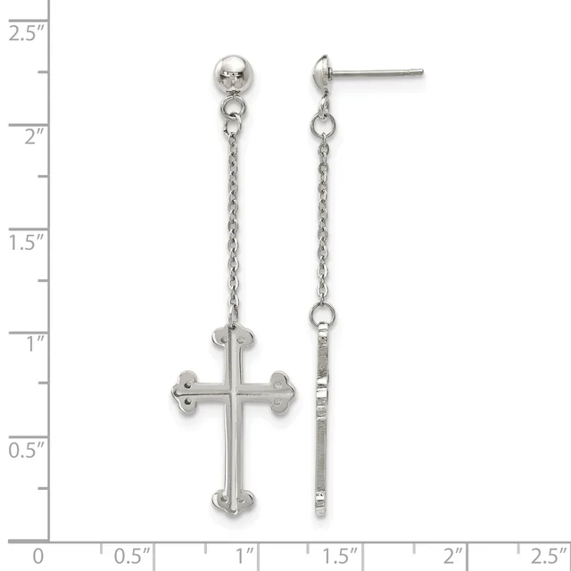 A pair of silver dangle earrings with ball studs connected by chains to ornate cross pendants, displayed against a measurement scale.