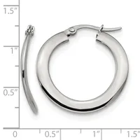 A pair of polished silver-toned hoop earrings with a thick, rounded profile and hinged closures, displayed against a measurement scale showing approximately 1.25 inches in diameter.